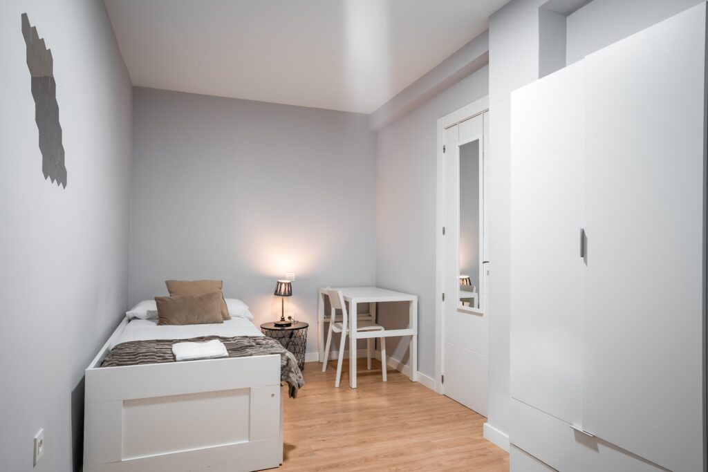 Dormitorio de Apartamento Turístico Quality Homes Estación de tren en Granada